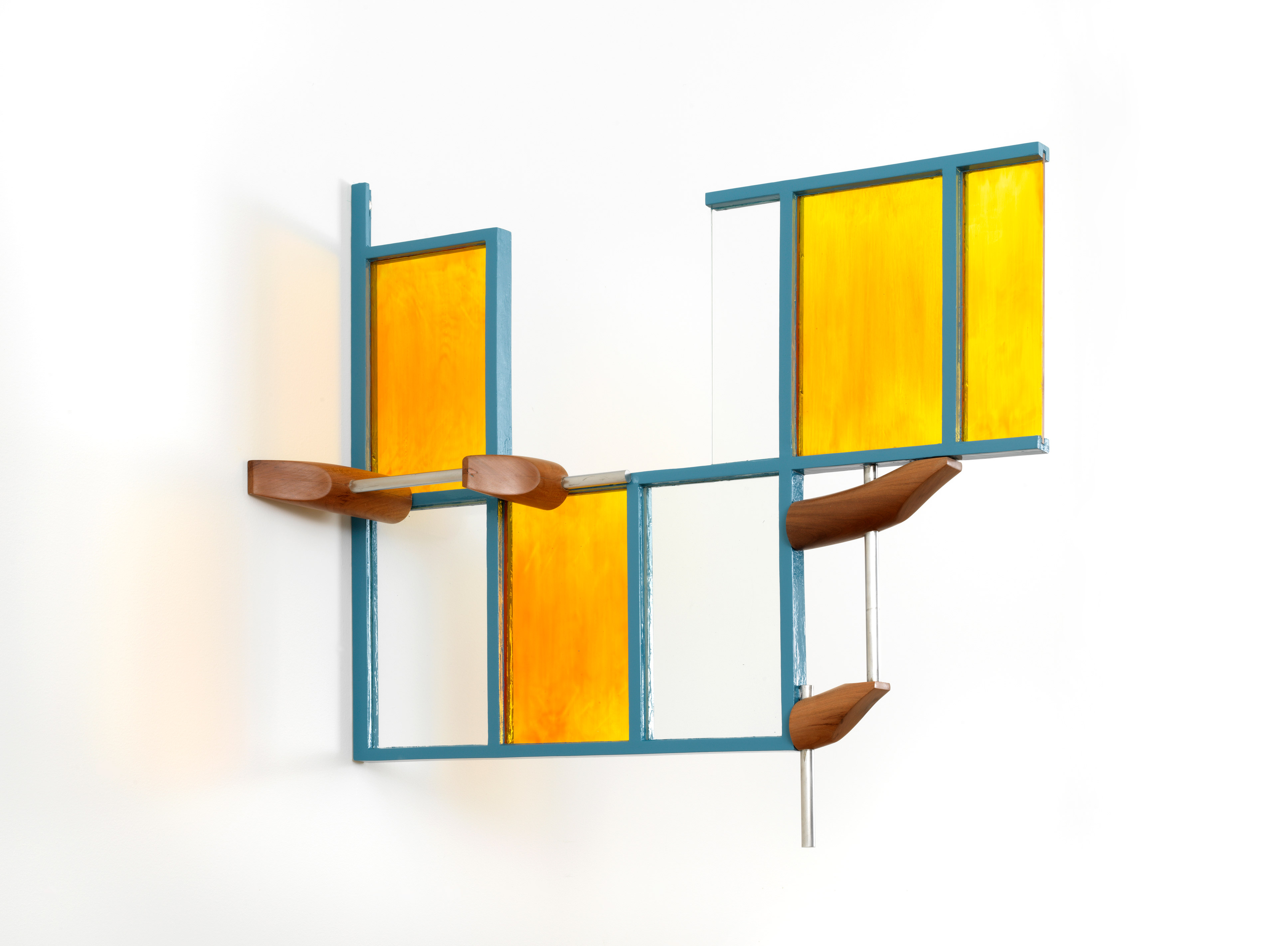Sculpture of clear or gold quadrilaterals framed in blue, with glass rods attached to the sides, piercing curved cherrywood